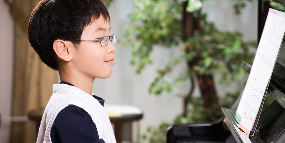 Asian Boy Playing Piano Edited